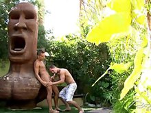 Sexy gay hunks fucking hard in a tropical garden